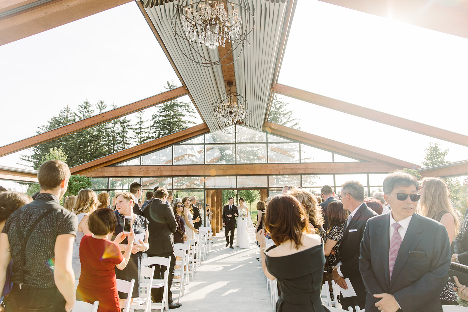 Bride walks down the aisle in an outdoor ceremony at Whistle Bear Golf Club