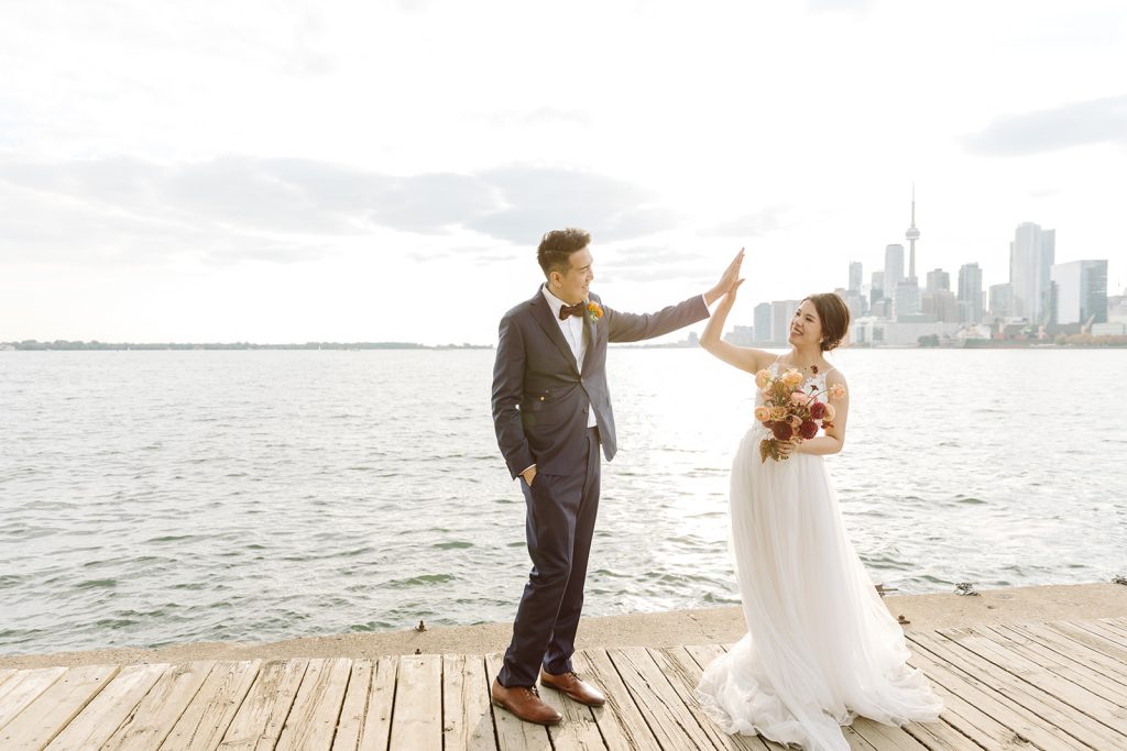 sunset photography of a bride and groom at sunset in toronto overlooking the lake