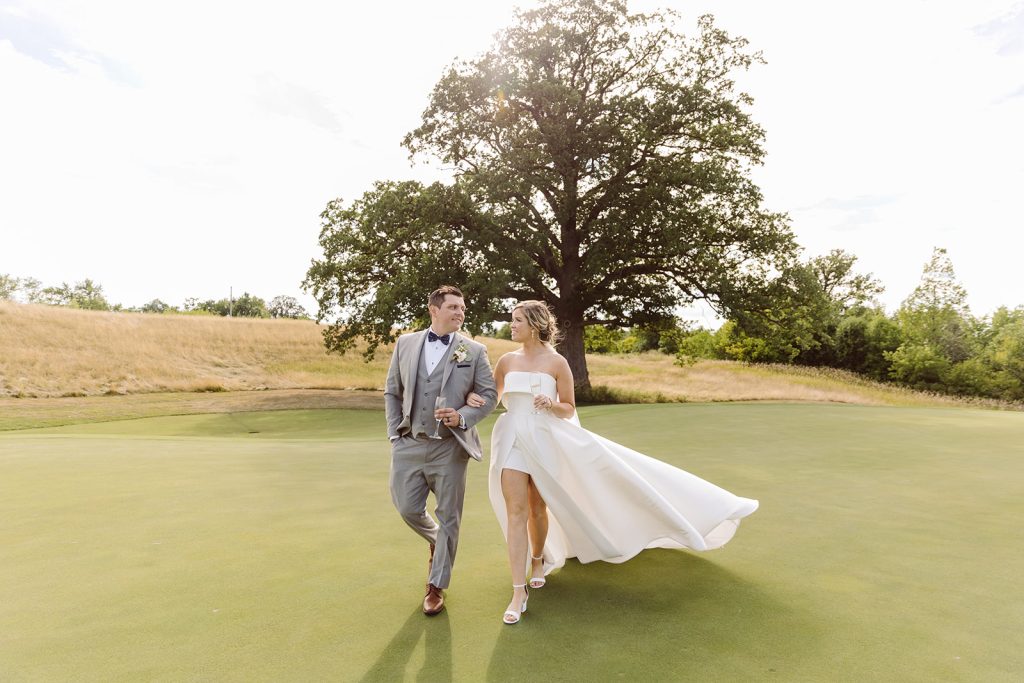 outdoor photos of a bride and groom on a golf course in burlington